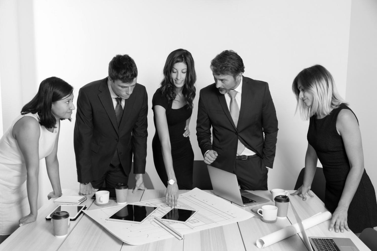 Business professionals collaborating on budget planning strategies in a modern Australian office environment