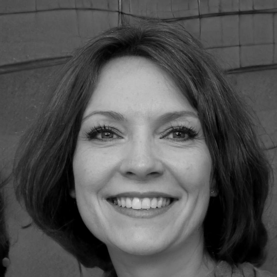 Financial consultant Rachel Pembroke reviewing budget documents