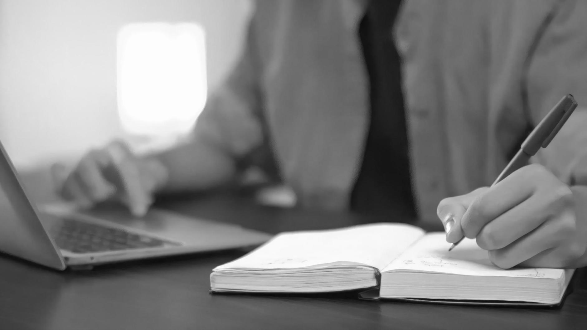 Modern office meeting room with financial charts displayed on wall monitors during team presentation